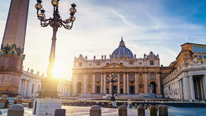 Saint Peter basilica in Vatican or Basilica Papale di San Pietro in Vaticano Rome, Italy at sunset in warm autumn evening